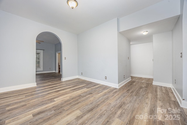 128 Allenton St, Norwood, NC 28128 - spare room with arched walkways, baseboards, and wood finished floors