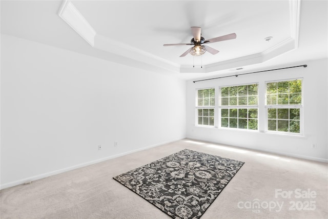 20827 Brinkley St, Cornelius, NC 28031 - carpeted empty room with a raised ceiling, ceiling fan, and ornamental molding