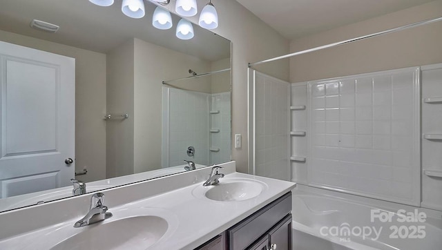full bathroom with double vanity, a sink, and shower / bathtub combination