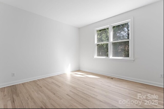15009 Lisha Ln, Charlotte, NC 28277 - empty room with baseboards, visible vents, and light wood-style floors