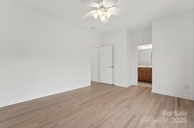 15009 Lisha Ln, Charlotte, NC 28277 - unfurnished bedroom featuring baseboards, ensuite bath, ceiling fan, and light wood-style flooring