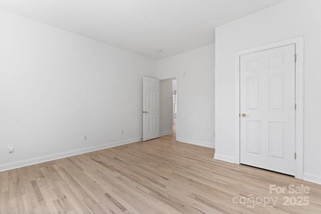 15009 Lisha Ln, Charlotte, NC 28277 - unfurnished bedroom featuring baseboards and light wood finished floors