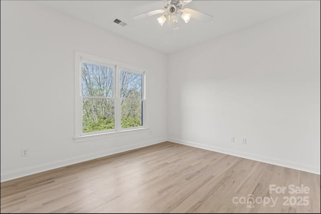 15009 Lisha Ln, Charlotte, NC 28277 - empty room with baseboards, light wood finished floors, and ceiling fan