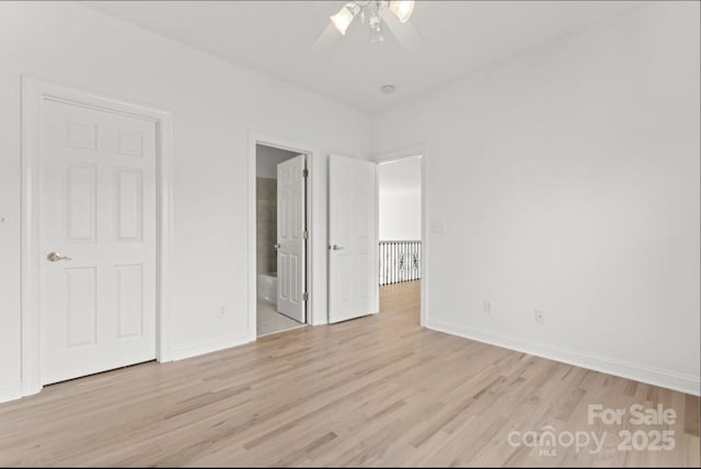 15009 Lisha Ln, Charlotte, NC 28277 - unfurnished bedroom featuring baseboards, light wood-style floors, ceiling fan, and ensuite bathroom