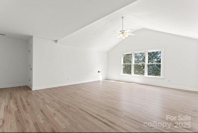 15009 Lisha Ln, Charlotte, NC 28277 - unfurnished living room with baseboards, lofted ceiling, ceiling fan, and wood finished floors