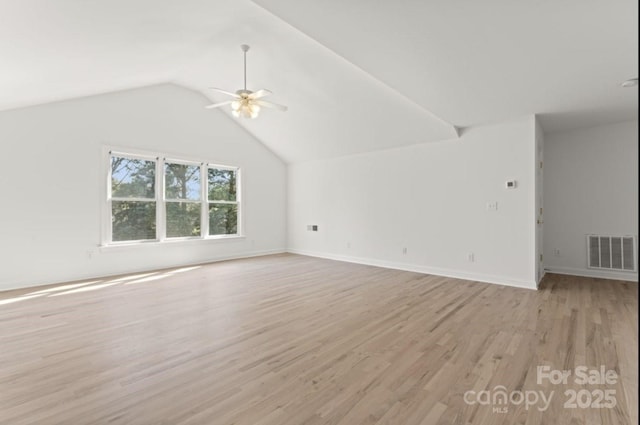 15009 Lisha Ln, Charlotte, NC 28277 - unfurnished living room with light wood finished floors, lofted ceiling, baseboards, visible vents, and ceiling fan
