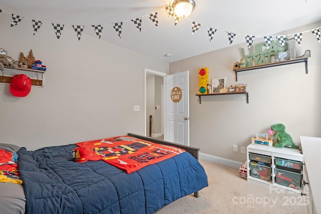bedroom featuring carpet and baseboards