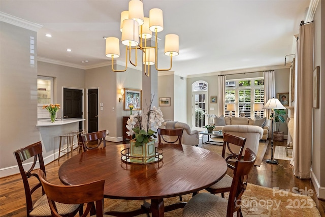 dining room with baseboards, recessed lighting, crown molding, and dark wood-type flooring