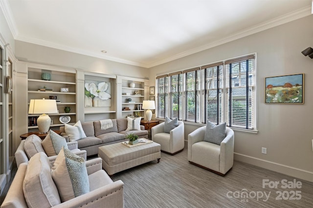 living area featuring ornamental molding and baseboards