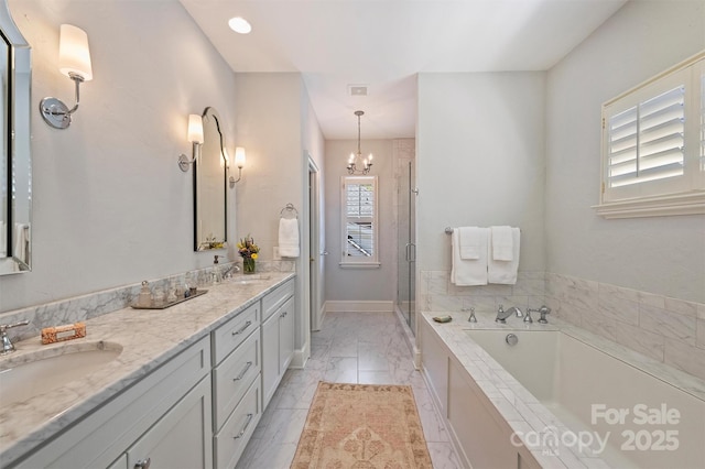 bathroom featuring a shower stall, double vanity, a bath, and a sink