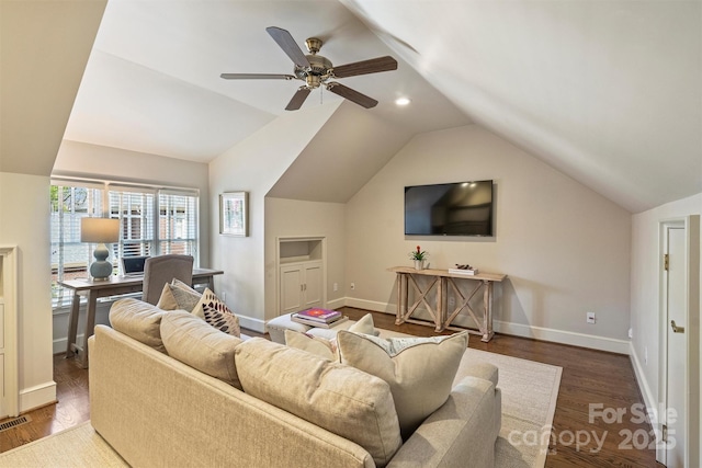 living room featuring baseboards, vaulted ceiling, wood finished floors, and a ceiling fan