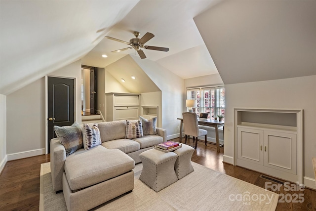 living room with baseboards, ceiling fan, wood finished floors, and vaulted ceiling