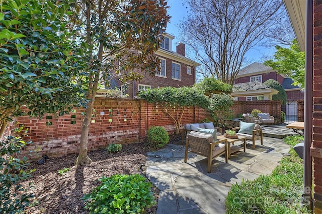 view of patio / terrace with an outdoor hangout area and fence