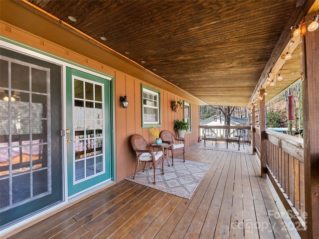 wooden terrace featuring covered porch