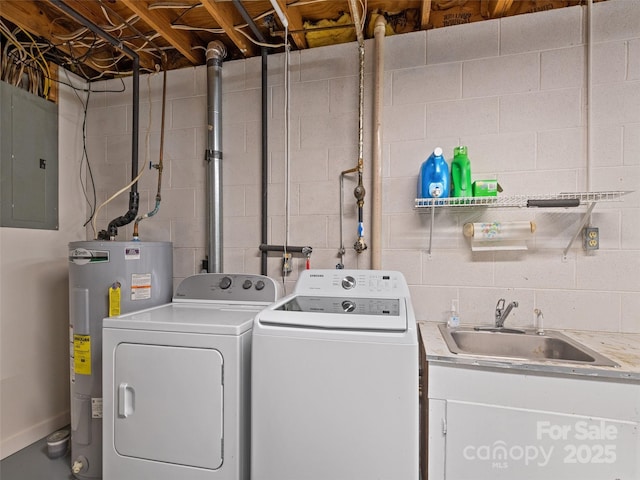 clothes washing area featuring laundry area, electric panel, separate washer and dryer, a sink, and water heater