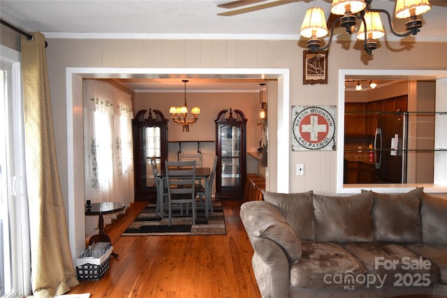 301 Pinnacle Inn Rd Unit 3219, Beech Mountain, NC 28604 - living room with a chandelier, wood finished floors, ceiling fan, and crown molding