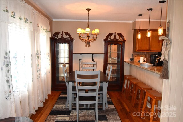 301 Pinnacle Inn Rd Unit 3219, Beech Mountain, NC 28604 - dining area featuring dark wood finished floors, a chandelier, and ornamental molding