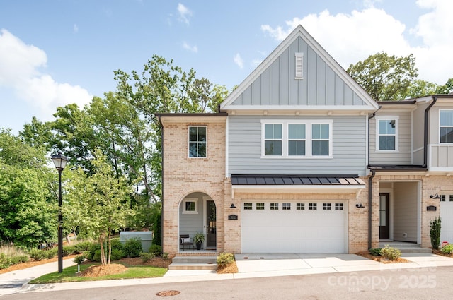 3111 Everly Enclave Way, Charlotte, NC 28210 - townhome / multi-family property featuring brick siding, an attached garage, board and batten siding, and concrete driveway
