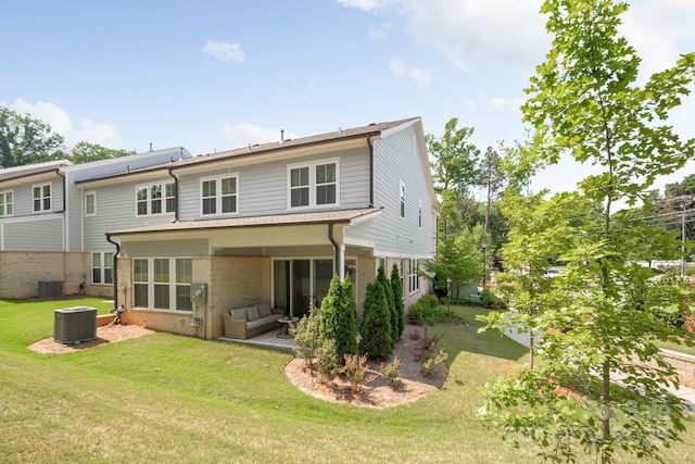 3111 Everly Enclave Way, Charlotte, NC 28210 - back of house featuring brick siding, central AC unit, a yard, and a patio