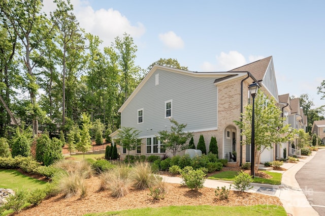 3111 Everly Enclave Way, Charlotte, NC 28210 - view of side of property with brick siding and driveway