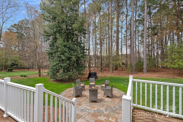 view of patio / terrace with an outdoor fire pit