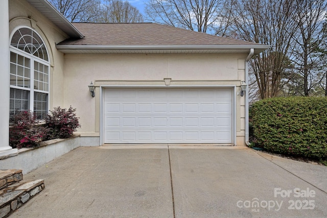 garage featuring driveway