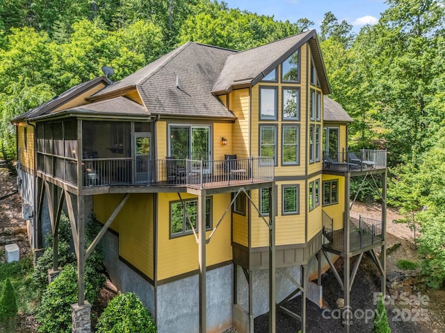 556 High Pines Loop, Lake Lure, NC 28746 - rear view of property with a sunroom, a wooden deck, and a shingled roof