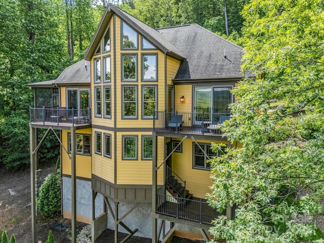 556 High Pines Loop, Lake Lure, NC 28746 - back of house with stairway, a balcony, and roof with shingles