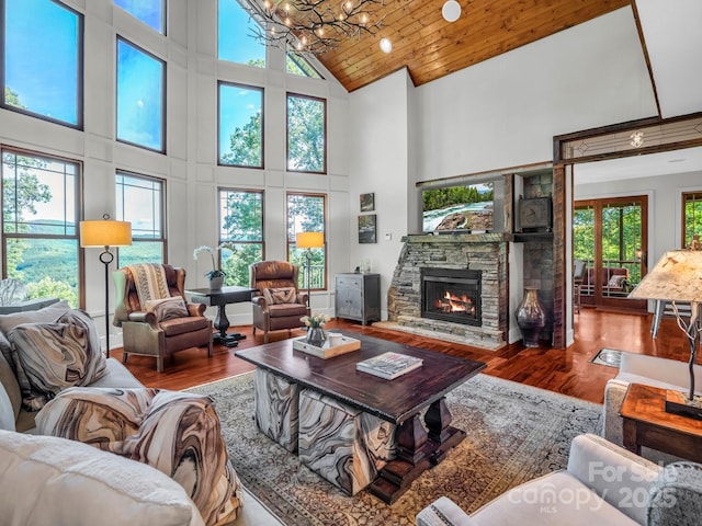 556 High Pines Loop, Lake Lure, NC 28746 - living room featuring high vaulted ceiling, wood finished floors, a chandelier, and a fireplace