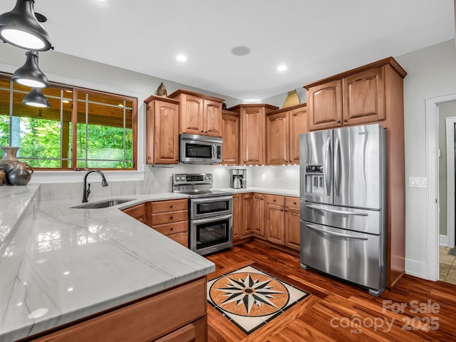 556 High Pines Loop, Lake Lure, NC 28746 - kitchen featuring stainless steel appliances, a sink, light stone counters, dark wood finished floors, and recessed lighting