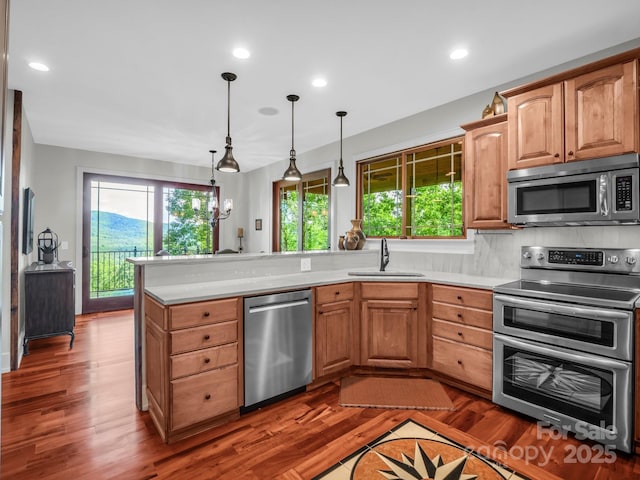 556 High Pines Loop, Lake Lure, NC 28746 - kitchen with stainless steel appliances, a sink, light countertops, a peninsula, and recessed lighting