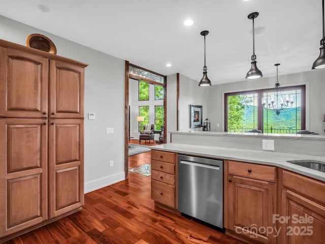 556 High Pines Loop, Lake Lure, NC 28746 - kitchen with dishwasher, dark wood-style flooring, light countertops, hanging light fixtures, and brown cabinets