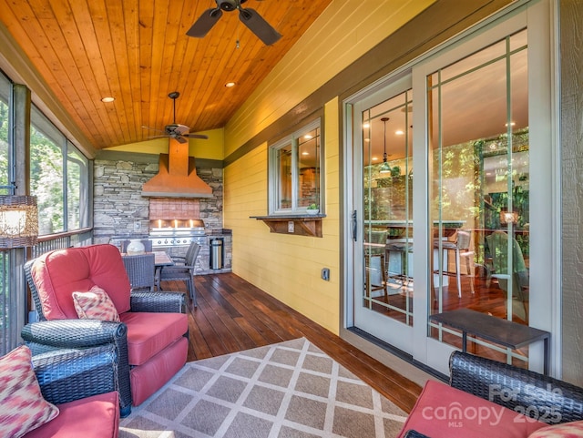 556 High Pines Loop, Lake Lure, NC 28746 - sunroom / solarium with ceiling fan, vaulted ceiling, and a fireplace