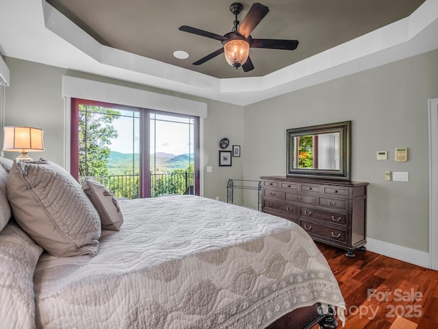 556 High Pines Loop, Lake Lure, NC 28746 - bedroom featuring access to outside, a raised ceiling, dark wood-style floors, baseboards, and ceiling fan