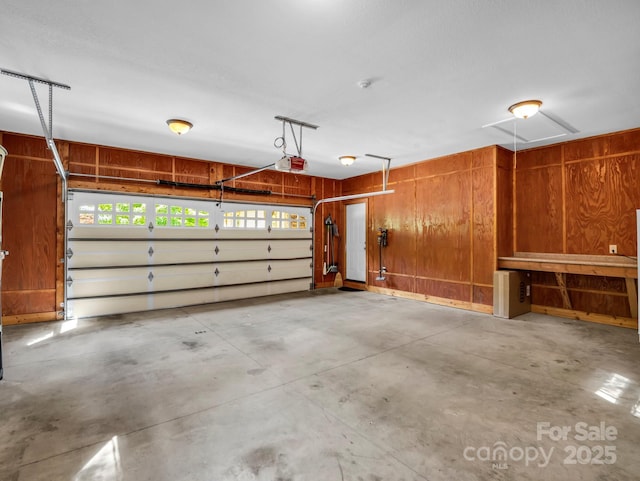 556 High Pines Loop, Lake Lure, NC 28746 - garage with a garage door opener and wooden walls