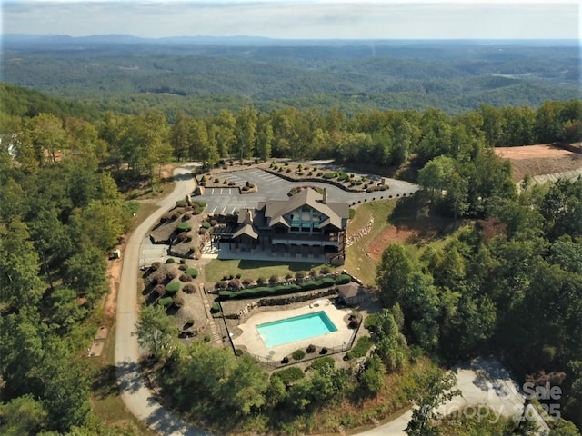 556 High Pines Loop, Lake Lure, NC 28746 - aerial view of property and surrounding area with a heavily wooded area and a pool area