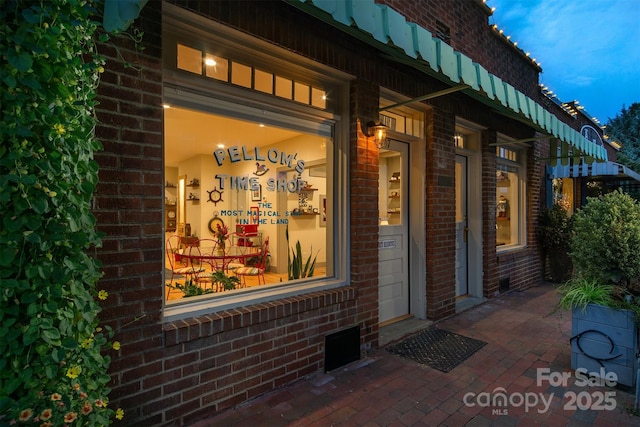 107 Cherry St, Black Mountain, NC 28711 - doorway to property featuring brick siding