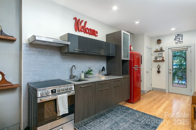 107 Cherry St, Black Mountain, NC 28711 - kitchen featuring backsplash, open shelves, wall chimney exhaust hood, stainless steel range with electric cooktop, and a sink