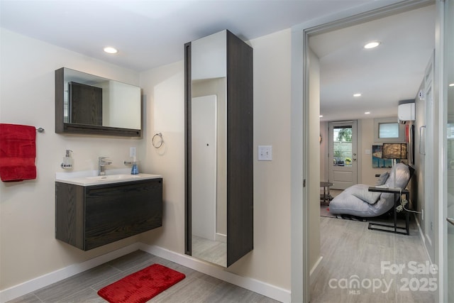 107 Cherry St, Black Mountain, NC 28711 - bathroom featuring recessed lighting, vanity, baseboards, and wood finished floors