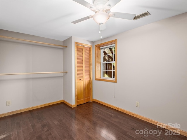 575 Twin Brook Dr, Waynesville, NC 28785 - unfurnished bedroom with baseboards, dark wood-style flooring, a closet, and ceiling fan