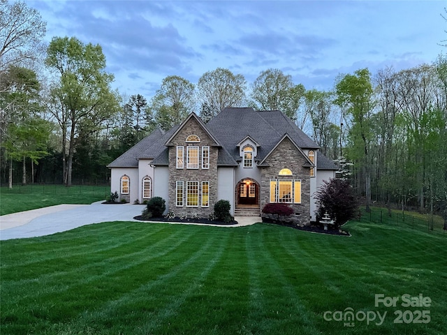 2017 Colorado Ct, Lancaster, SC 29720 - french provincial home featuring stone siding, stucco siding, and driveway