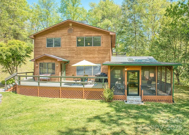 1192 Rockdale Rd, Whittier, NC 28789 - rear view of house featuring a sunroom, a shingled roof, a wooden deck, and a yard