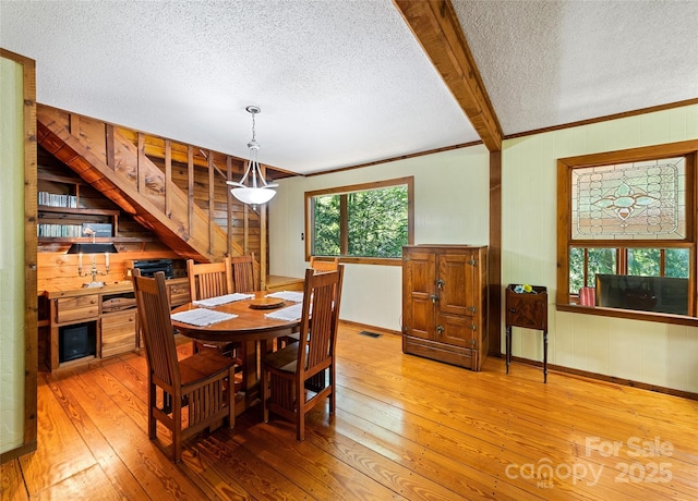 1192 Rockdale Rd, Whittier, NC 28789 - dining room featuring visible vents, light wood-style flooring, and a textured ceiling