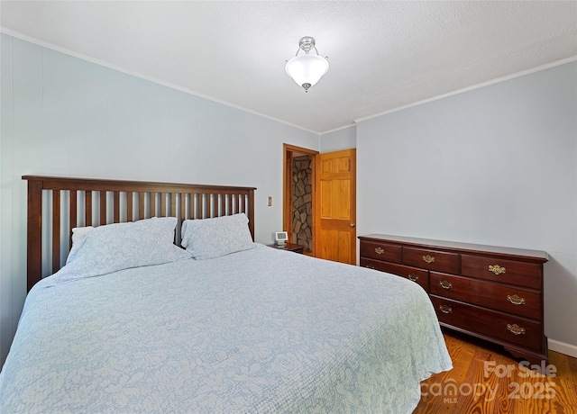 1192 Rockdale Rd, Whittier, NC 28789 - bedroom with ornamental molding and wood finished floors