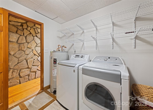 1192 Rockdale Rd, Whittier, NC 28789 - washroom with water heater, laundry area, and washing machine and clothes dryer