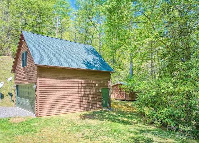 1192 Rockdale Rd, Whittier, NC 28789 - exterior space with a shingled roof, a garage, a shed, an outdoor structure, and gravel driveway