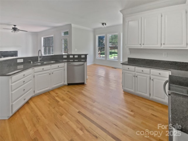 kitchen featuring open floor plan, ceiling fan, a sink, and dishwasher