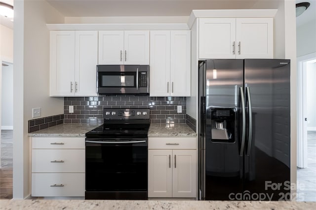 220 Mount Allen Heights, Black Mountain, NC 28711 - kitchen with appliances with stainless steel finishes, tasteful backsplash, and white cabinetry