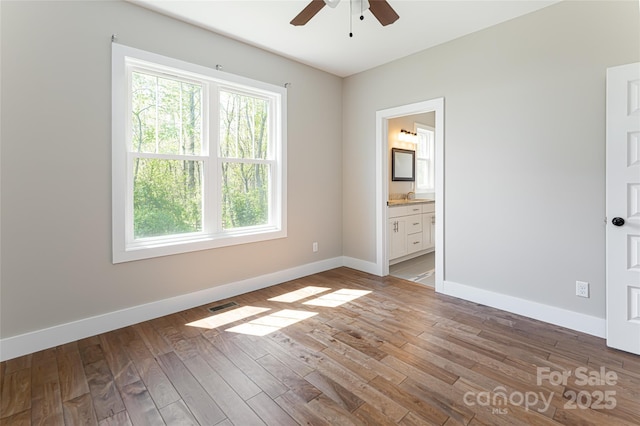 220 Mount Allen Heights, Black Mountain, NC 28711 - unfurnished bedroom featuring wood finished floors, ensuite bath, and a ceiling fan
