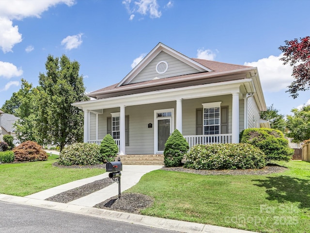 4148 Cedar Point Ave, Matthews, NC 28104 - view of front of house featuring a front lawn and a porch